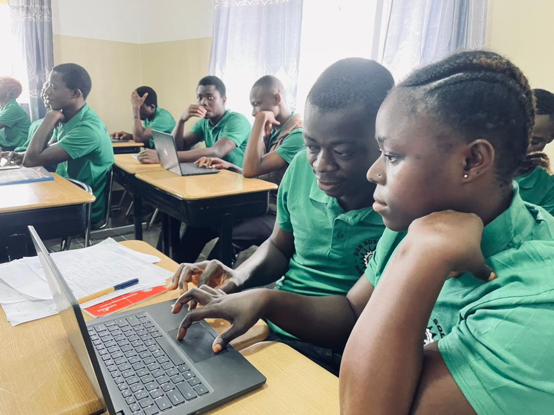 Student Learning how to use Laptop in class